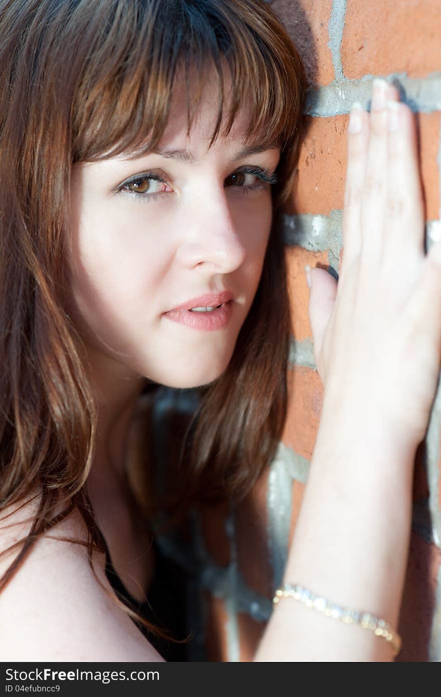 Close-up portrait of young redhead against the wall. Close-up portrait of young redhead against the wall