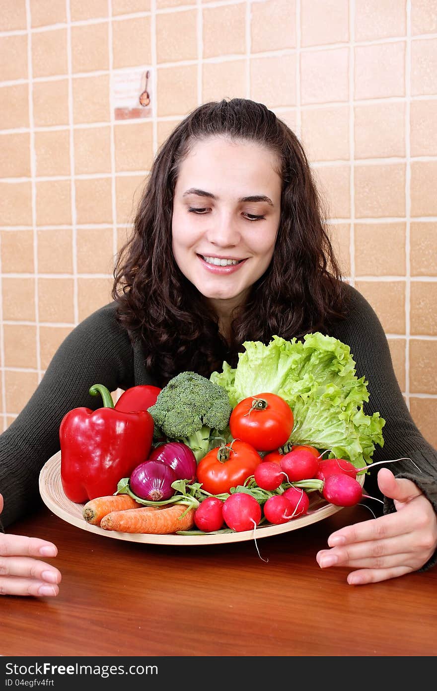 Beautiful Young Woman Eating Vegetable Salad