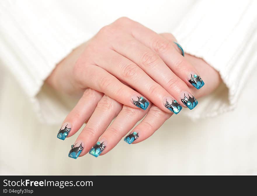 Female Hands With Blue Manicure