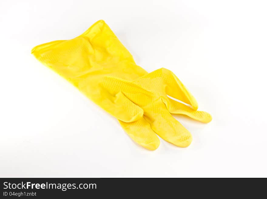 Yellow plastic glove on white background. Yellow plastic glove on white background