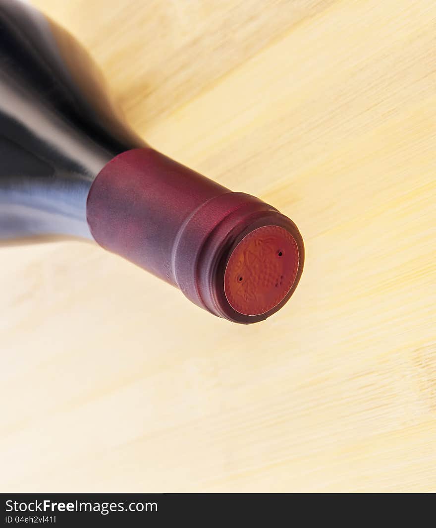 Red Wine Bottle On Wooden Table