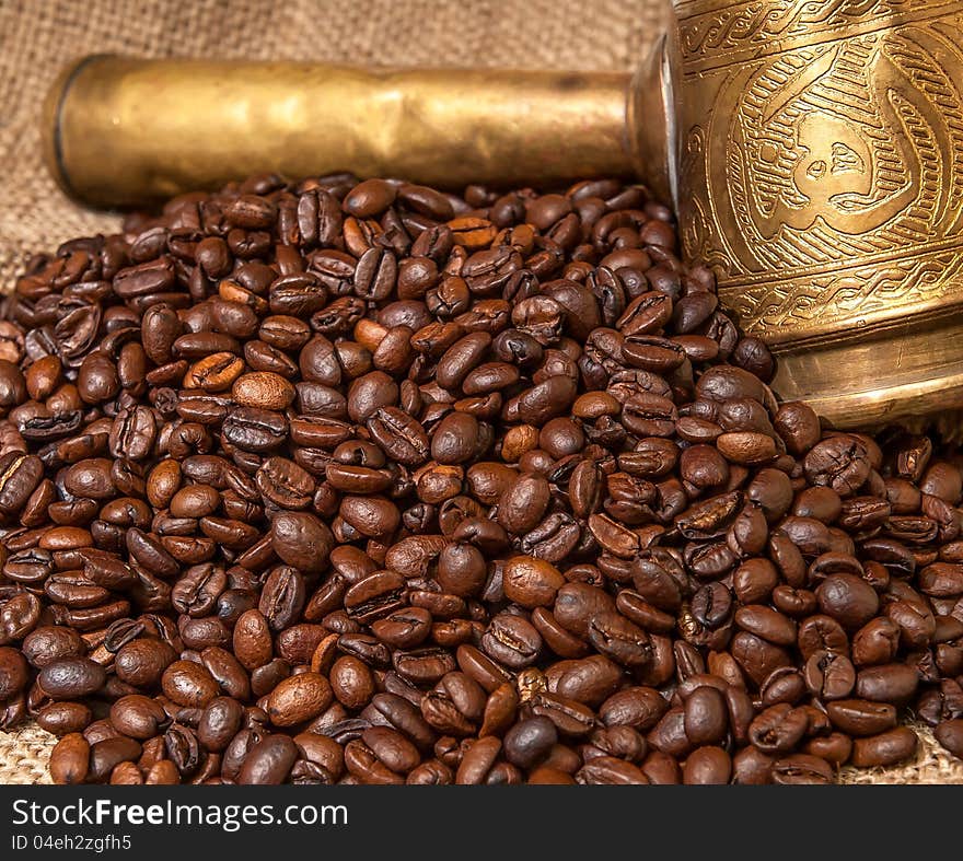 Arabic old copper turks and scattered coffee grains. Arabic old copper turks and scattered coffee grains