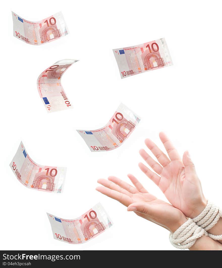 Hands tied with rope reaching out towards falling euros banknotes. Hands tied with rope reaching out towards falling euros banknotes