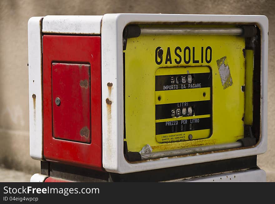 Old vintage gas pump in mining town in the west coast of Sardinia. Old vintage gas pump in mining town in the west coast of Sardinia.