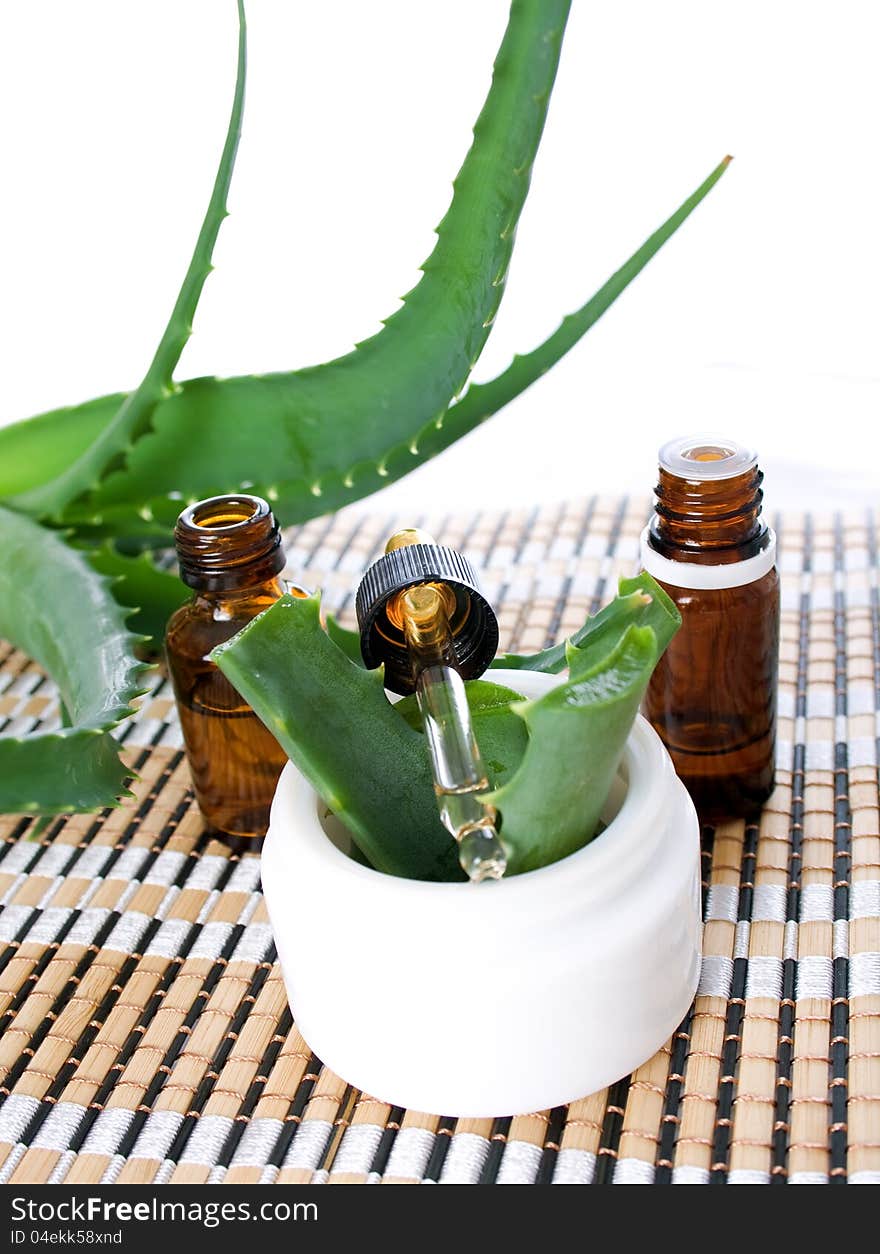 Aloe vera essential oil and cream isolated on white background