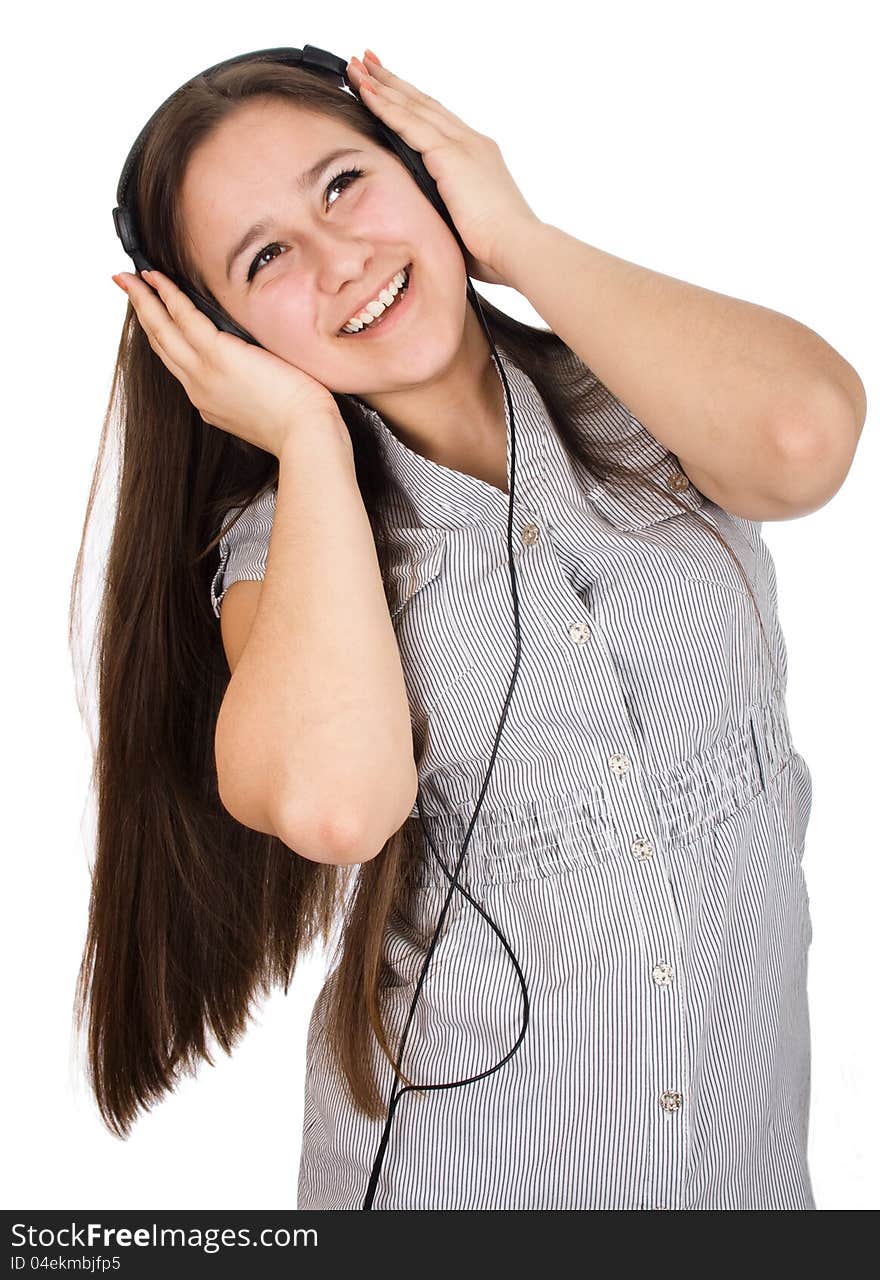 Young girl happily listening to music on headphones. Young girl happily listening to music on headphones