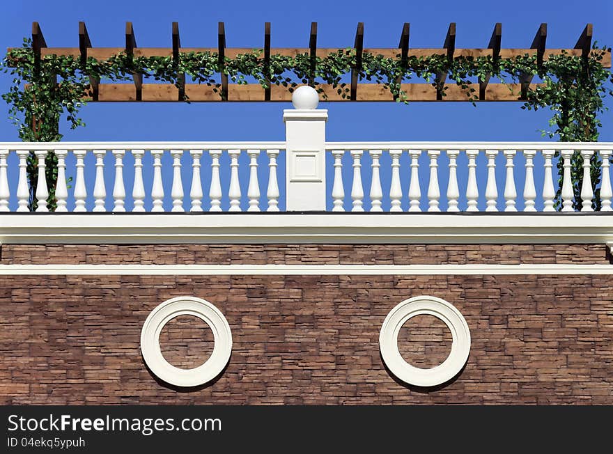 Beautiful terrace with white fence and green leafs