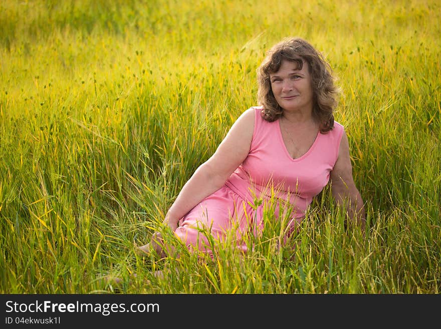 Beautiful senior woman in the wheat field. Beautiful senior woman in the wheat field