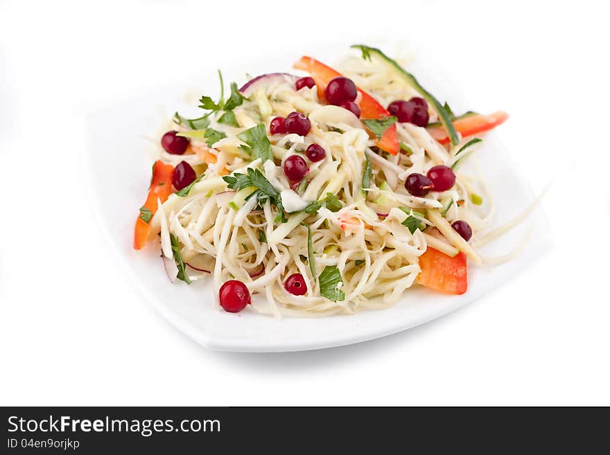 Plate with cabbage, cow-berry, pepper, salinity on white. russian traditional snack. Plate with cabbage, cow-berry, pepper, salinity on white. russian traditional snack