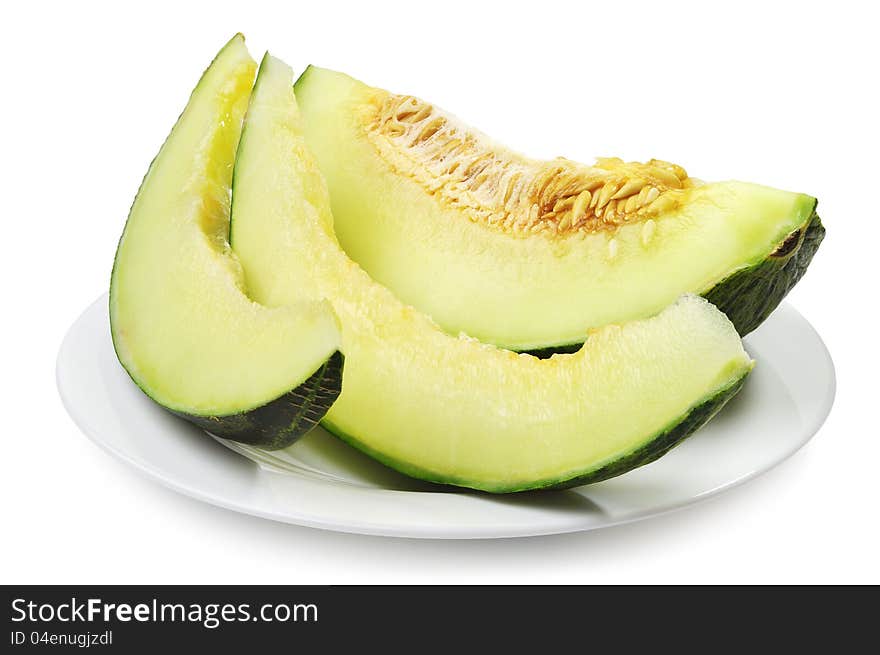 Melon slices on a plate on white