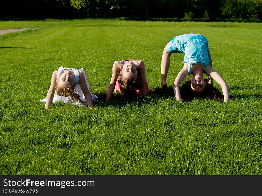 Three Girls Doing Exercises, In Nature