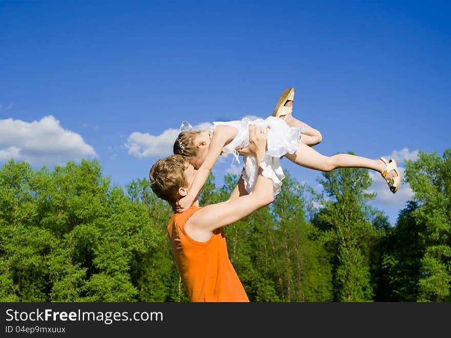 Father Raise Daughter On Hands