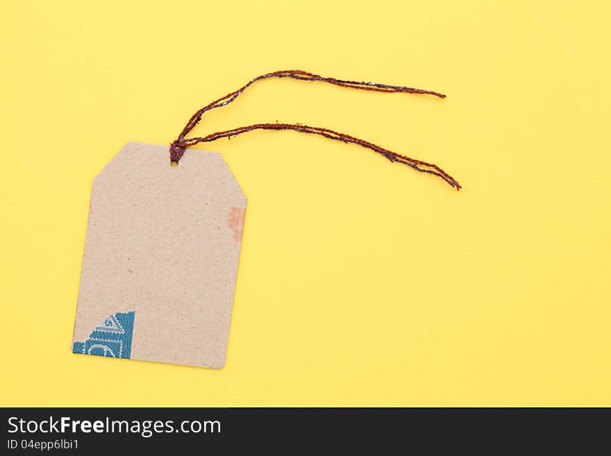 Blank tag on yellow paper background