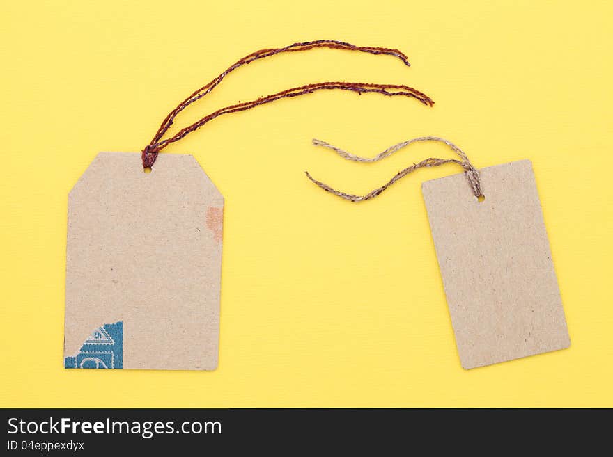 Blank tag on yellow paper background