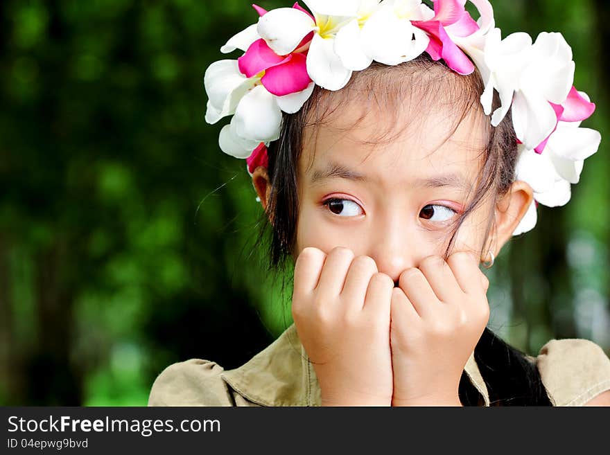 Cute asian girl's hand of the chin and looked to the side. Cute asian girl's hand of the chin and looked to the side