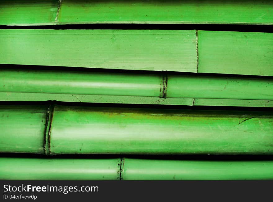 Stack of green bamboo trunks