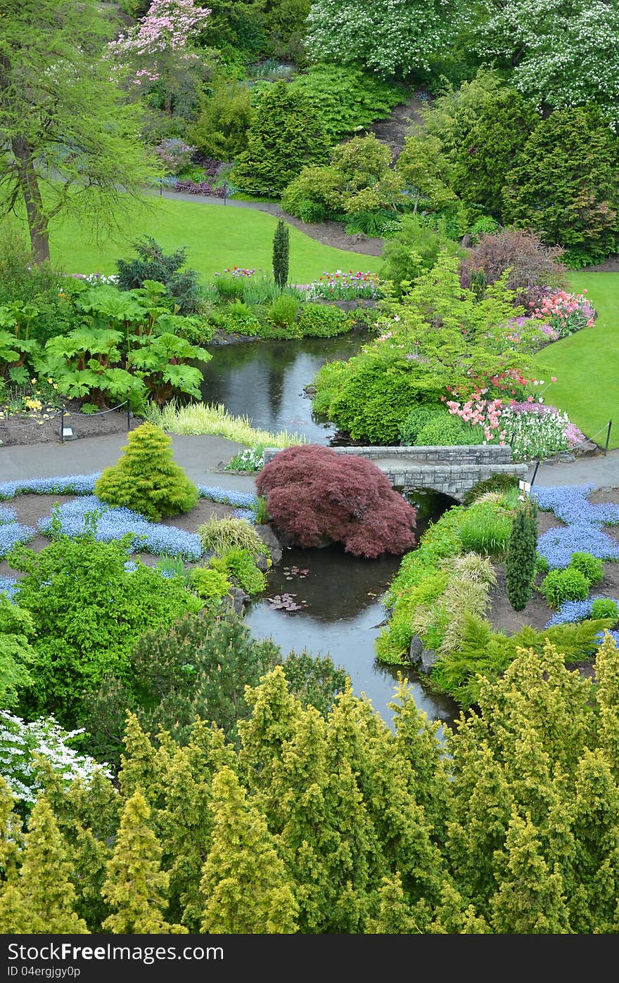 Lush spring garden park with pond. Lush spring garden park with pond