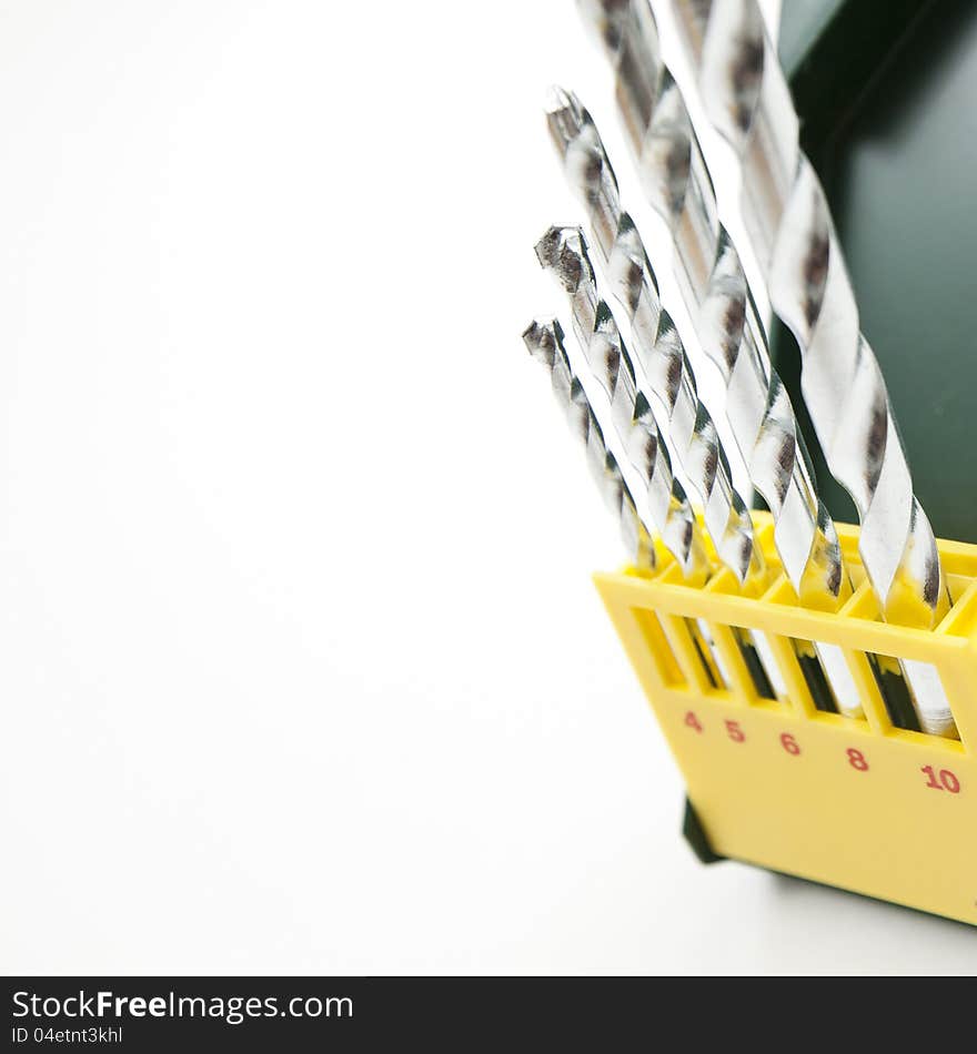 Set fo drills in a green box on white isolated background