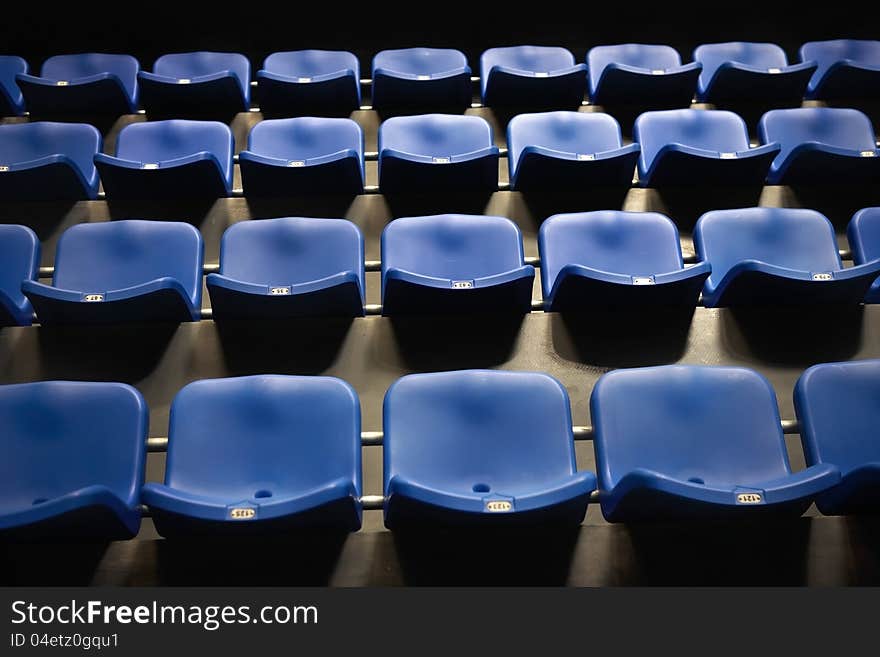 Rows pf empty blue seats in the stadium