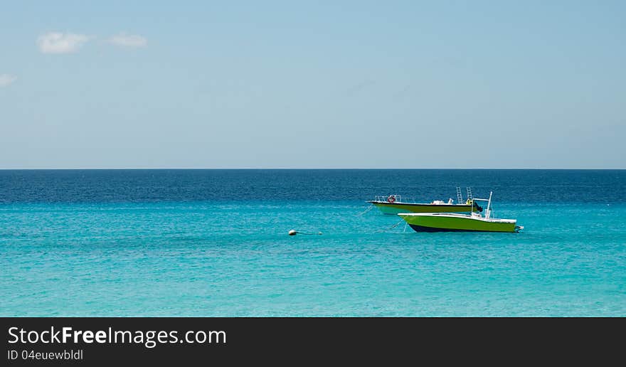 Two yellow boat in the caribbean ocean. Two yellow boat in the caribbean ocean