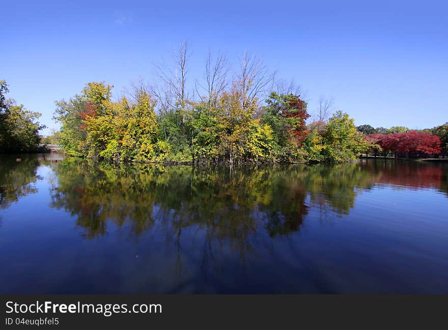 Scenic autumn landscape of an island in the lake