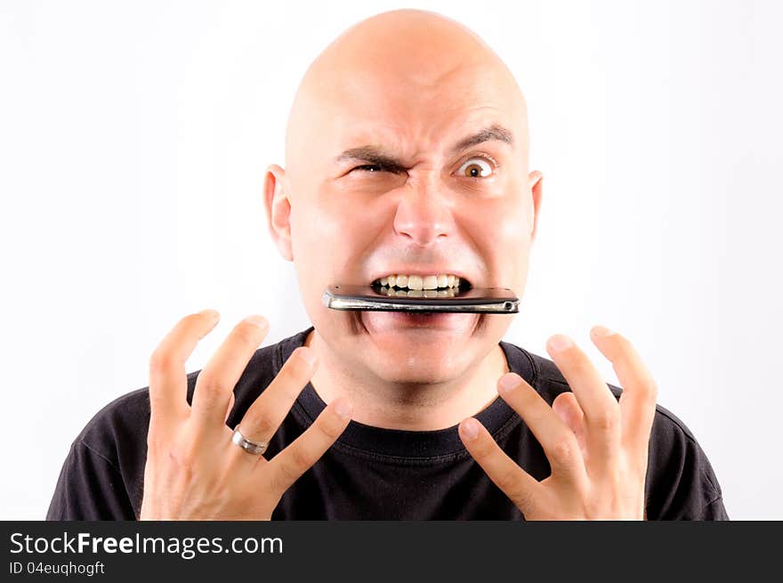 Bald guy eating mobile phone