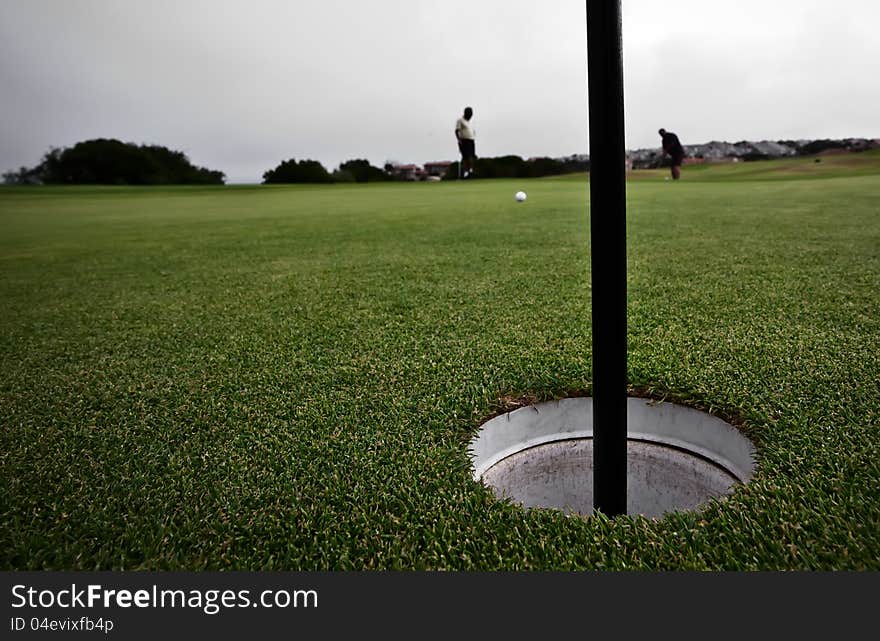 Golfing in a country club. Golfing in a country club.