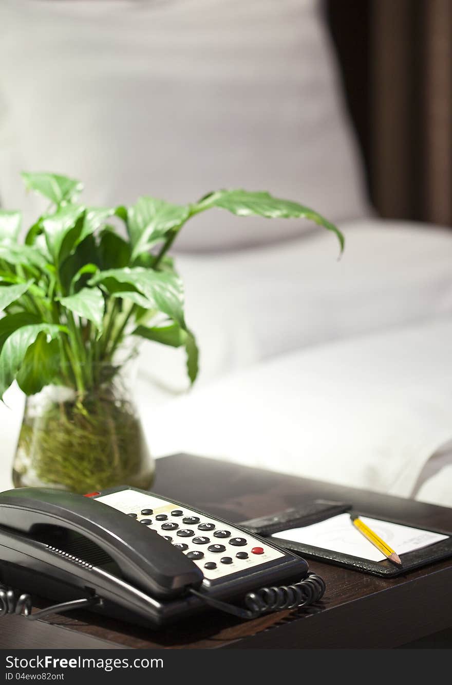 In the hotel bedroom neat put the paper and a pen and other office supplies 
. In the hotel bedroom neat put the paper and a pen and other office supplies