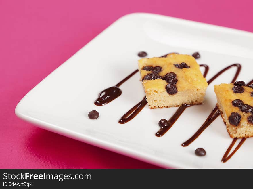 Gluten free chocholate chip cake on a white plate. Gluten free chocholate chip cake on a white plate