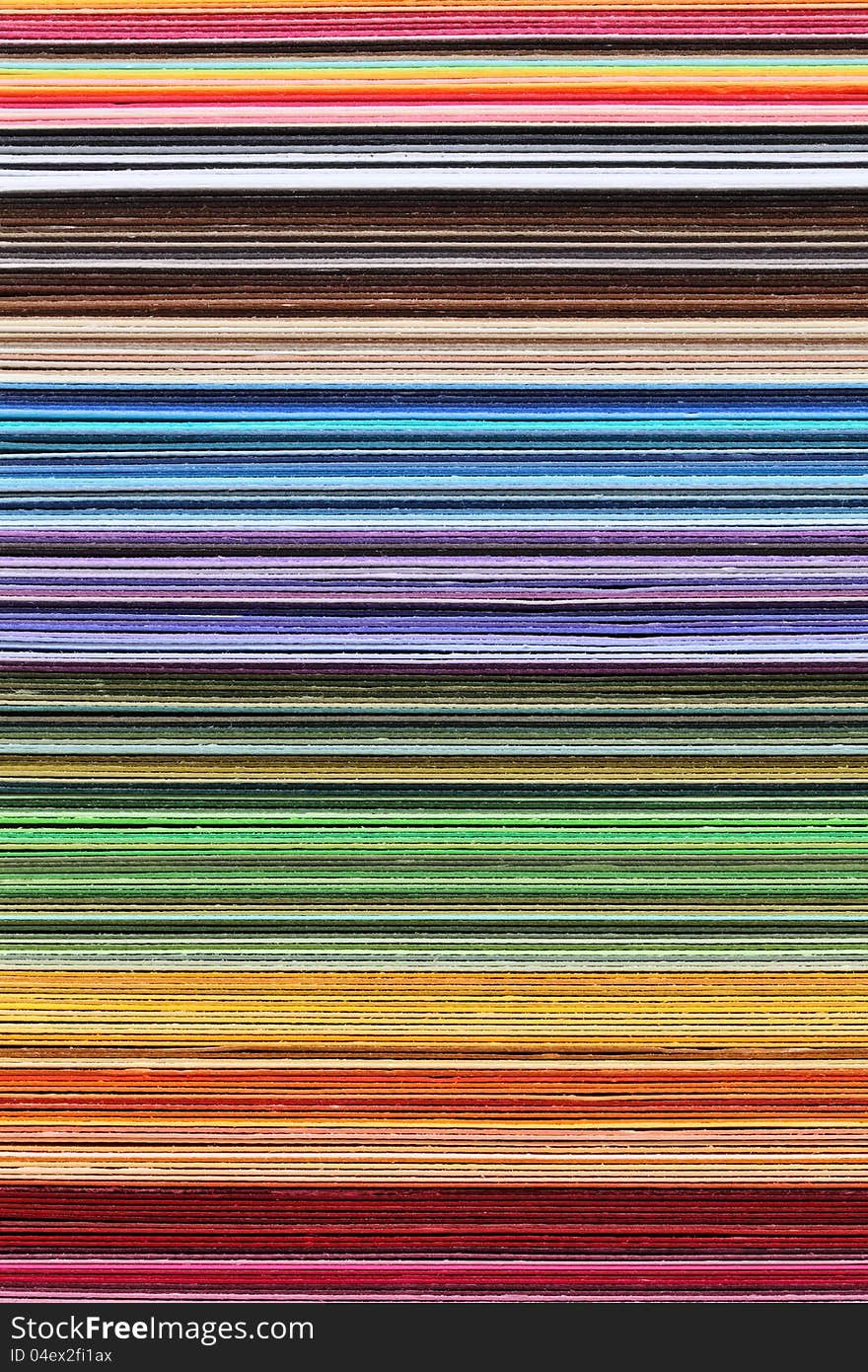 Close up of a stack of colorful paper