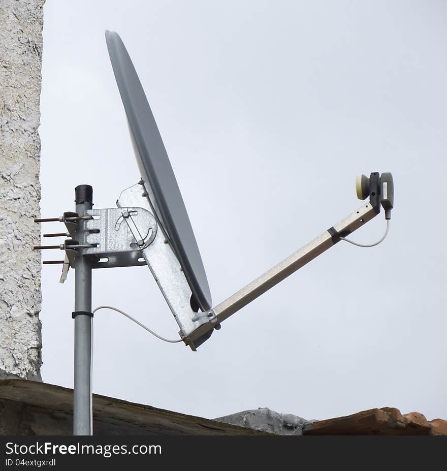 Dish of parabolic aerial on a roof