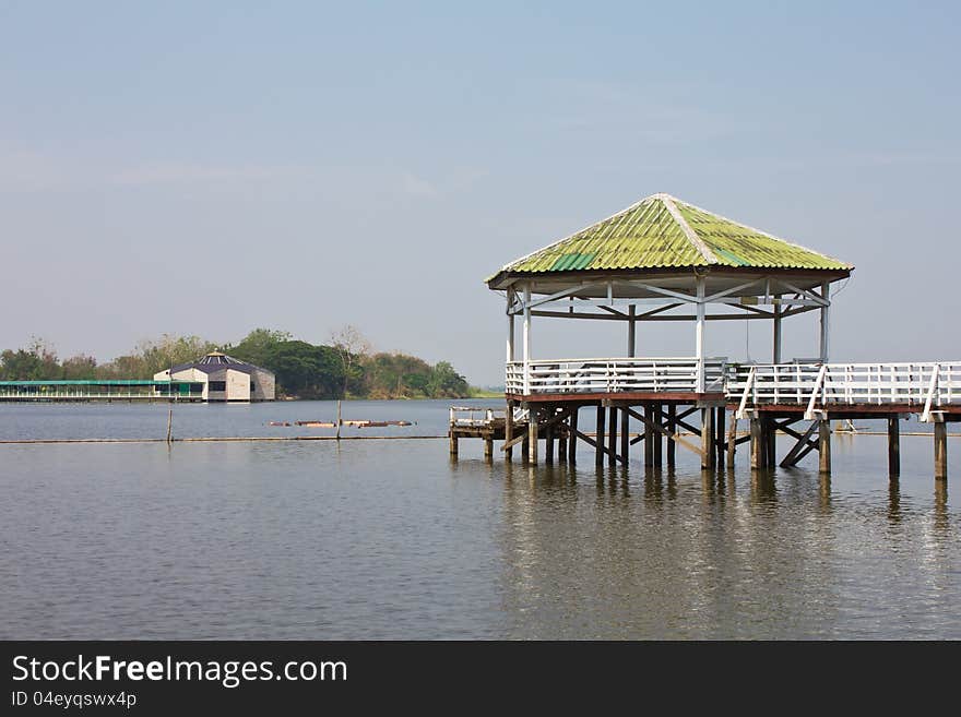 Pavilion Square is a green roof is located on the water, away from Pavilion to one.Generally in Thailand, any kind of art decorated in Buddhist church, temple pavilion, temple hall, monk’s house etc. creaced with money donated by people to hire artist. They are public domain or treasure of Buddhism, no restrict in copy or use, no name of artist appear (but, if there is artist name, it only for t. Pavilion Square is a green roof is located on the water, away from Pavilion to one.Generally in Thailand, any kind of art decorated in Buddhist church, temple pavilion, temple hall, monk’s house etc. creaced with money donated by people to hire artist. They are public domain or treasure of Buddhism, no restrict in copy or use, no name of artist appear (but, if there is artist name, it only for t