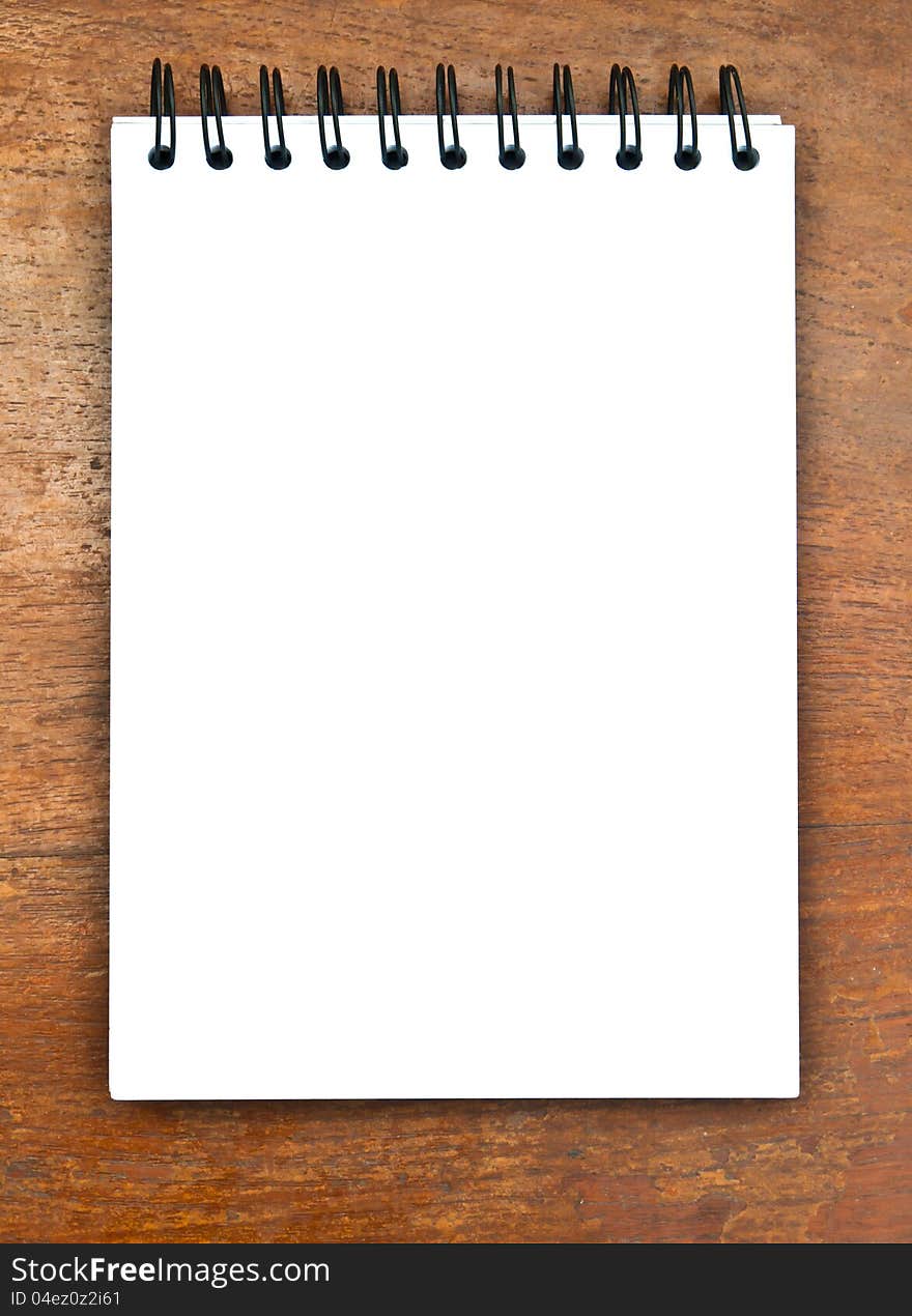 White Notebook on wood table. White Notebook on wood table