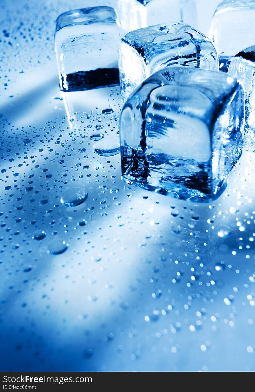 Ice cubes over wet backgrounds with back light