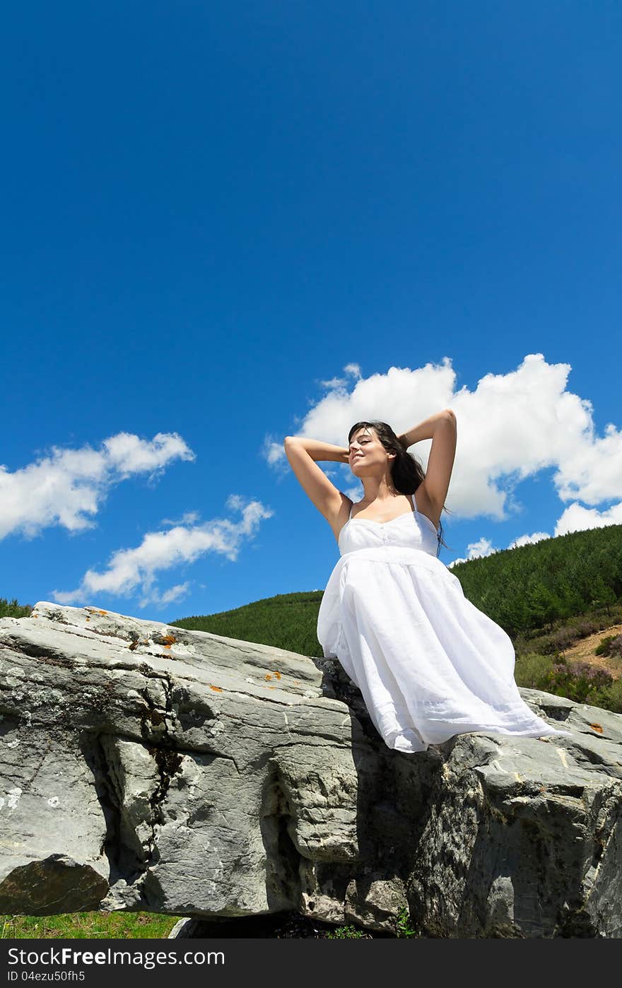 Woman feeling the air and heat in her face in nature. Woman feeling the air and heat in her face in nature.