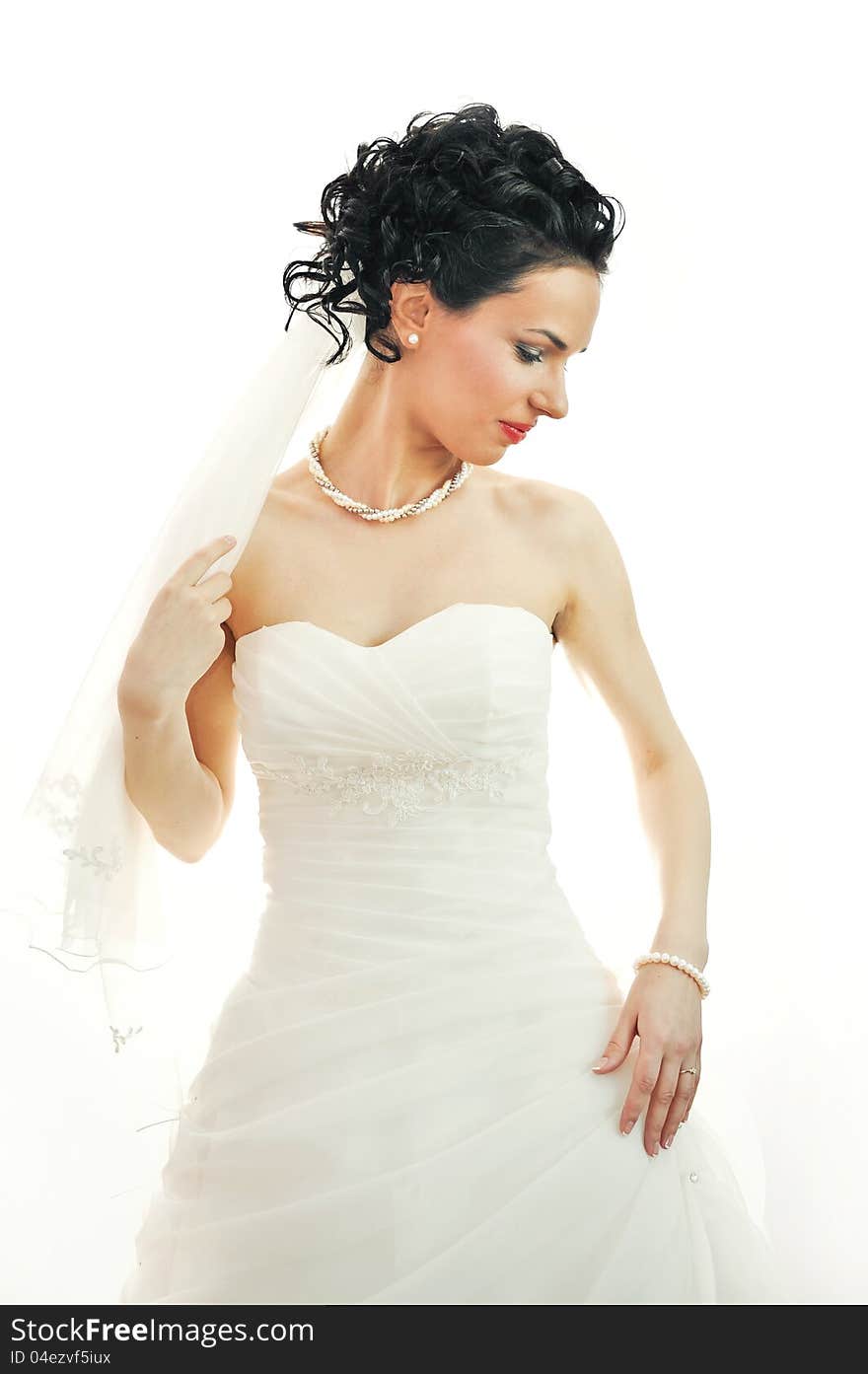 Portrait of a beautiful woman dressed as a bride. on white background