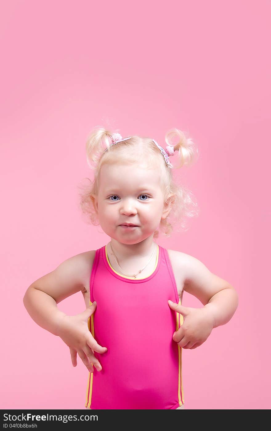 Portrait of a girl in a pink bathing suit