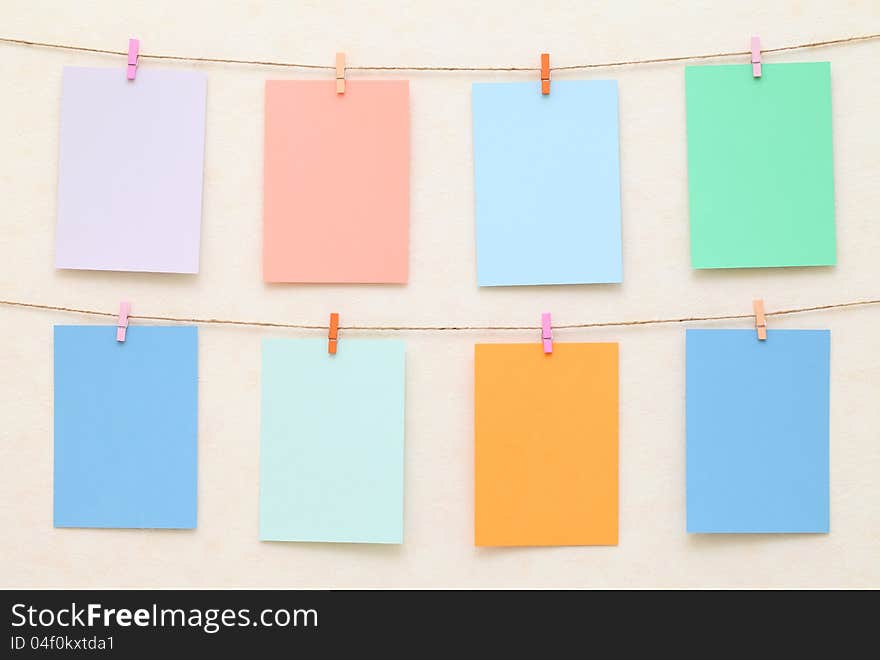 Hanging colorful Sheet of Paper with clothespins. Hanging colorful Sheet of Paper with clothespins