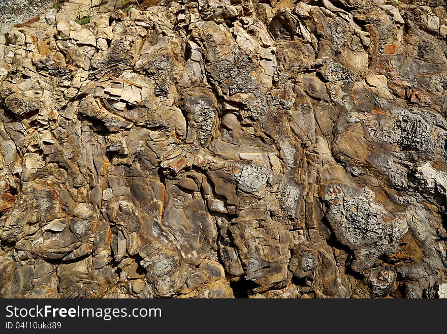 Background with a textured stone granite rocks and minerals. Background with a textured stone granite rocks and minerals