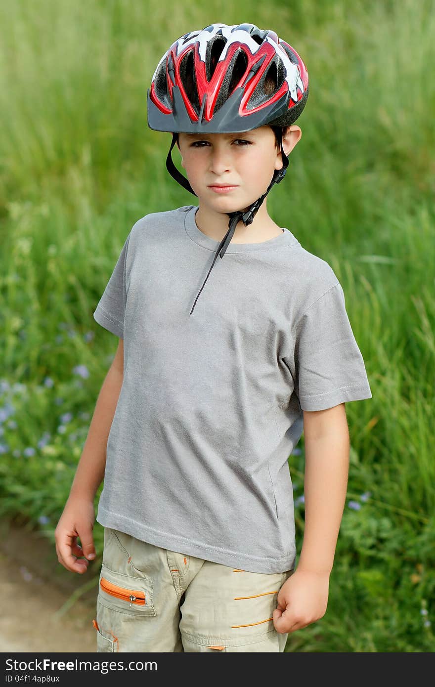 Portrait Of Boy Bicyclist With Helmet