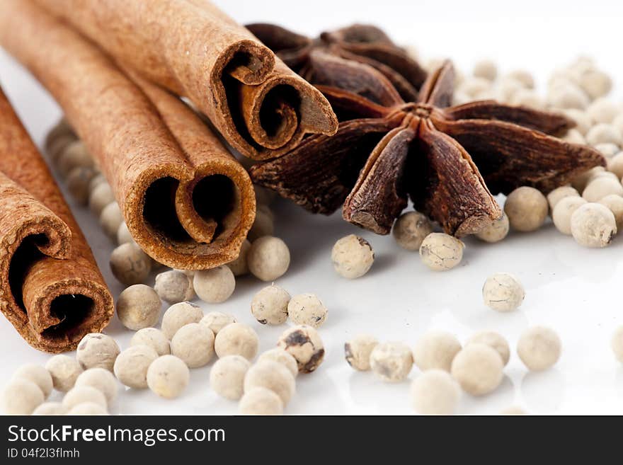 Star Anise, Cinnamon and White Pepper on White Background. Star Anise, Cinnamon and White Pepper on White Background