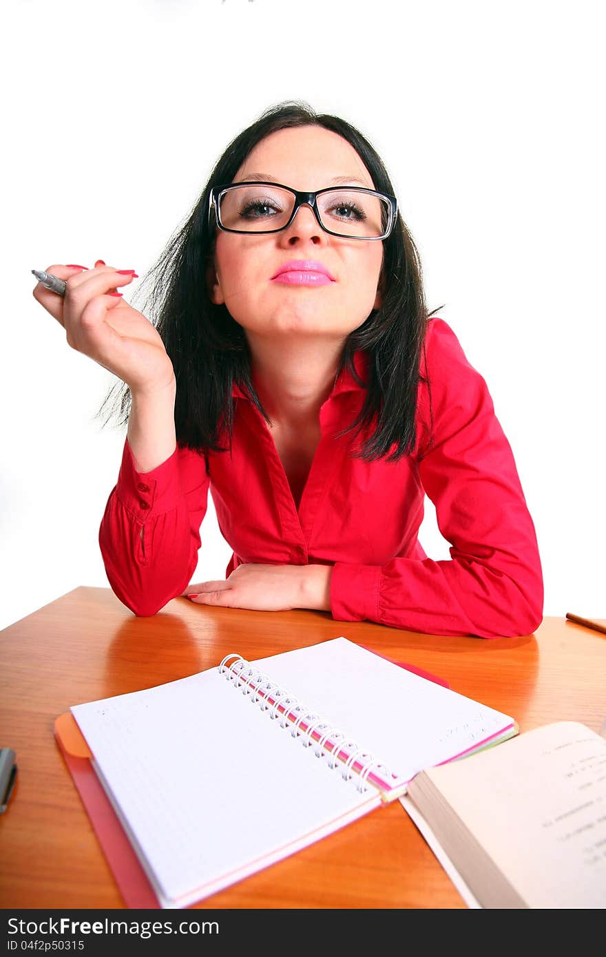 Brunette girl sitting at a table isolated Background