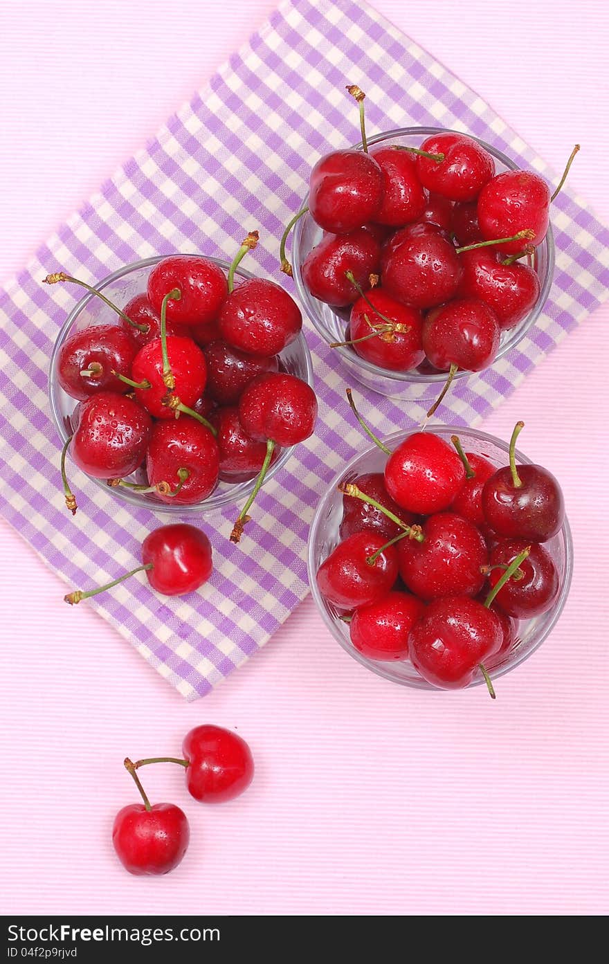 Cups with fresh cherries