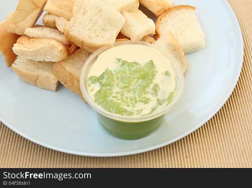 Bread with custard on dish