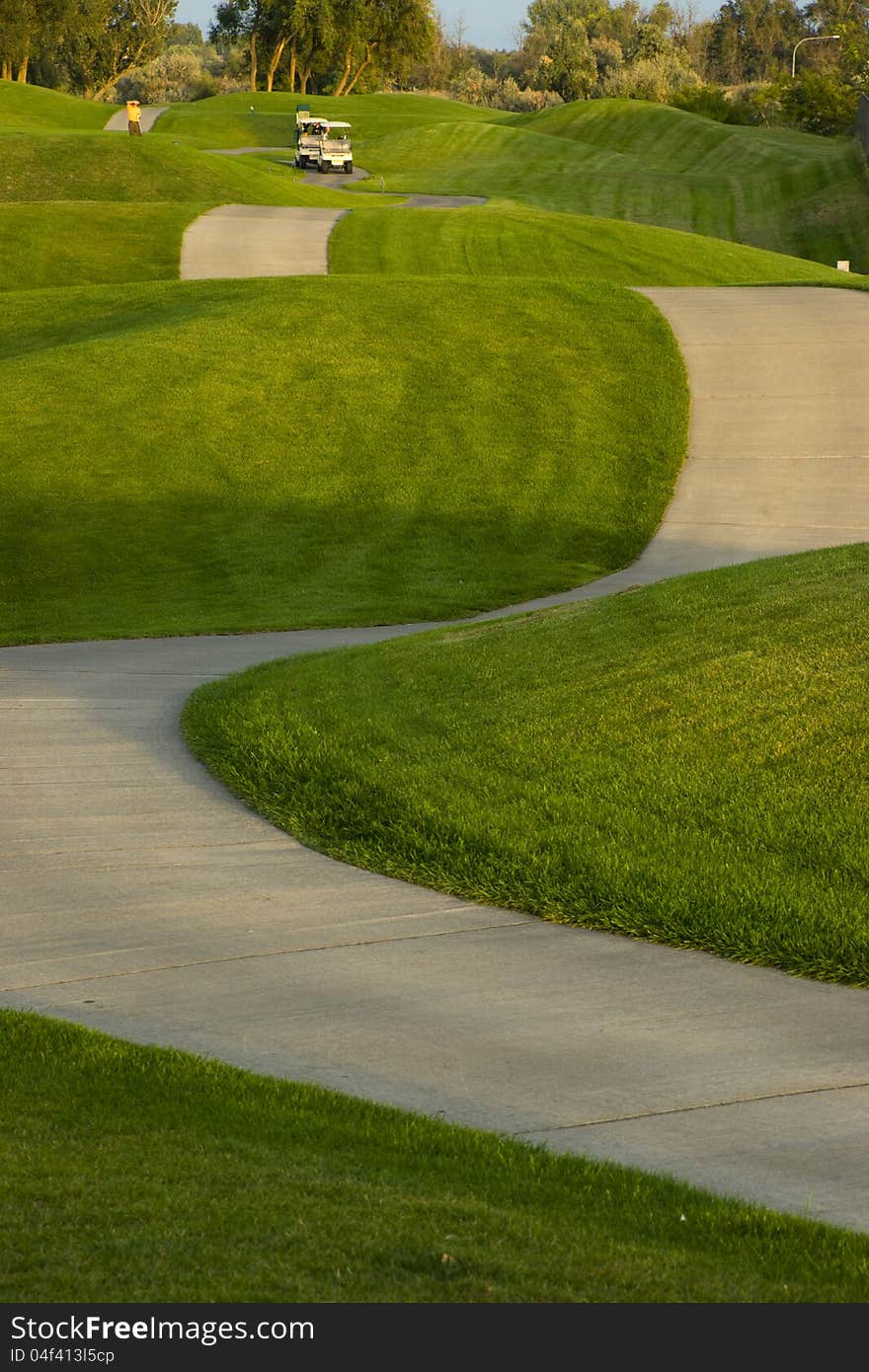 Two golfer approach the ninth hole. Two golfer approach the ninth hole