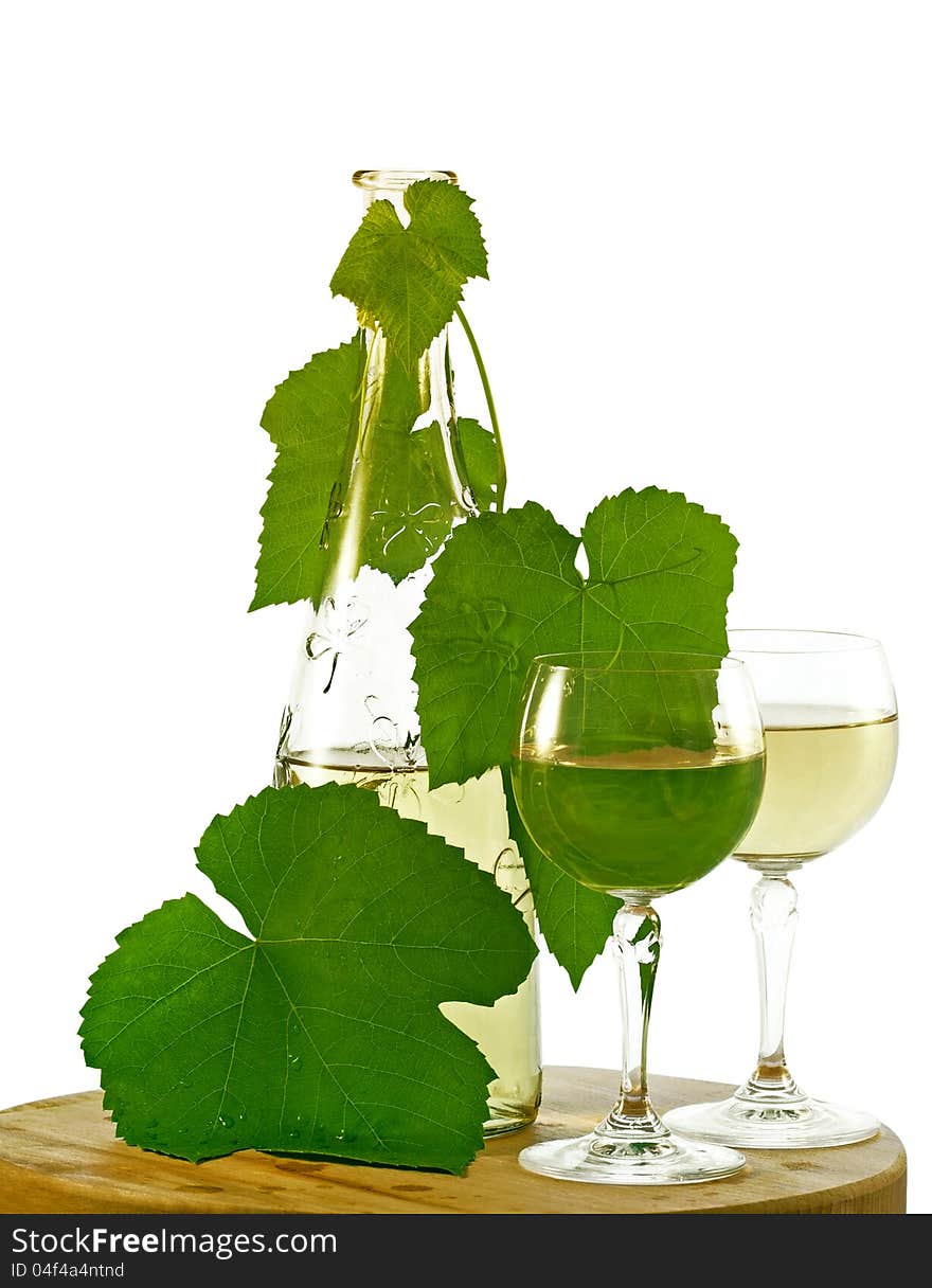 A bottle of white wine and two wineglasses isolated on white background. Sepia toning