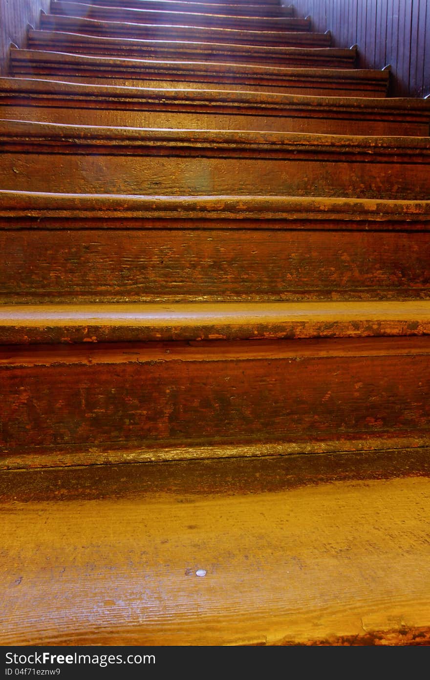 Old, well-worn wooden steps ascending. Old, well-worn wooden steps ascending