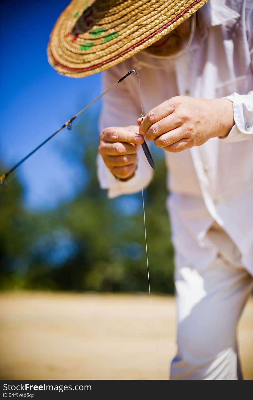 Fisherman preparing the rod