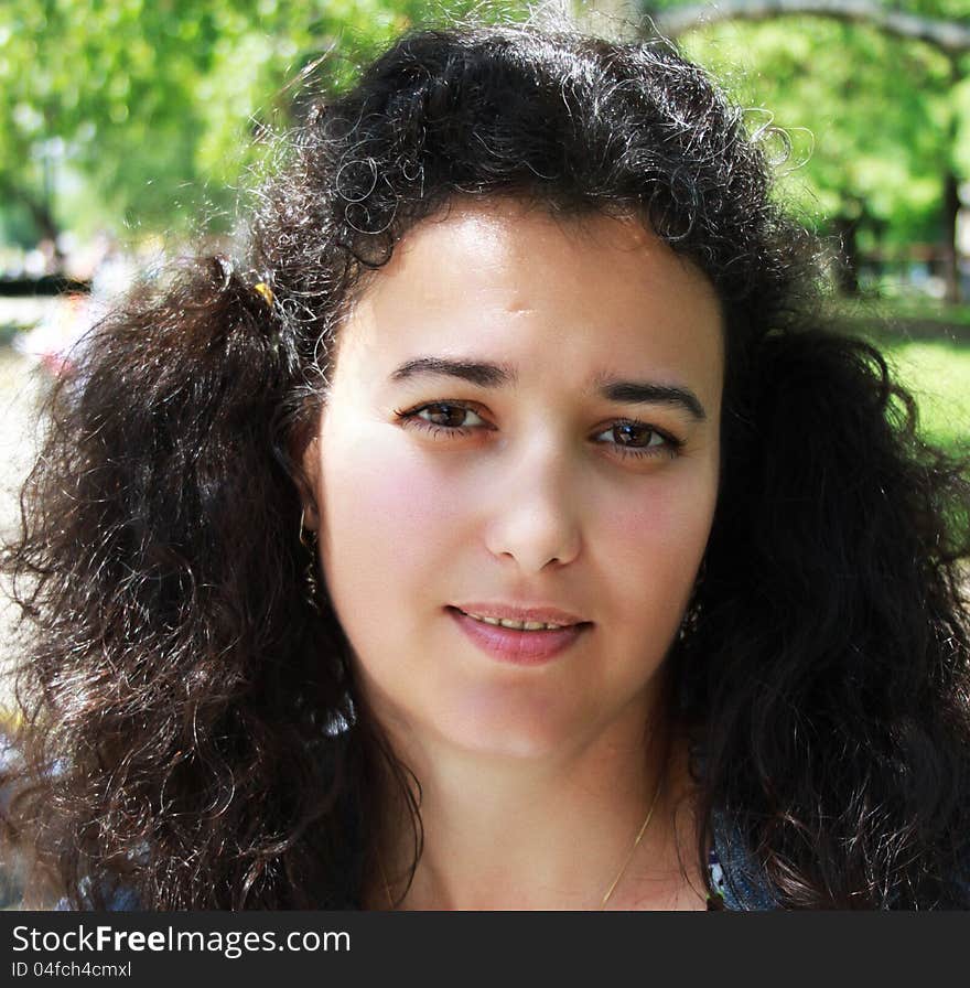 Portrait of beautiful girl with curly hair tied in two tails. Portrait of beautiful girl with curly hair tied in two tails