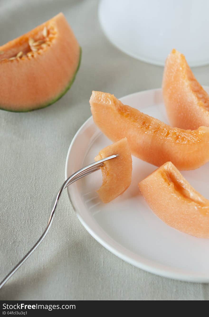 Dish with slices of melon